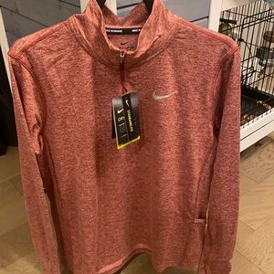Nike women’s dri-fit in burgundy size M.